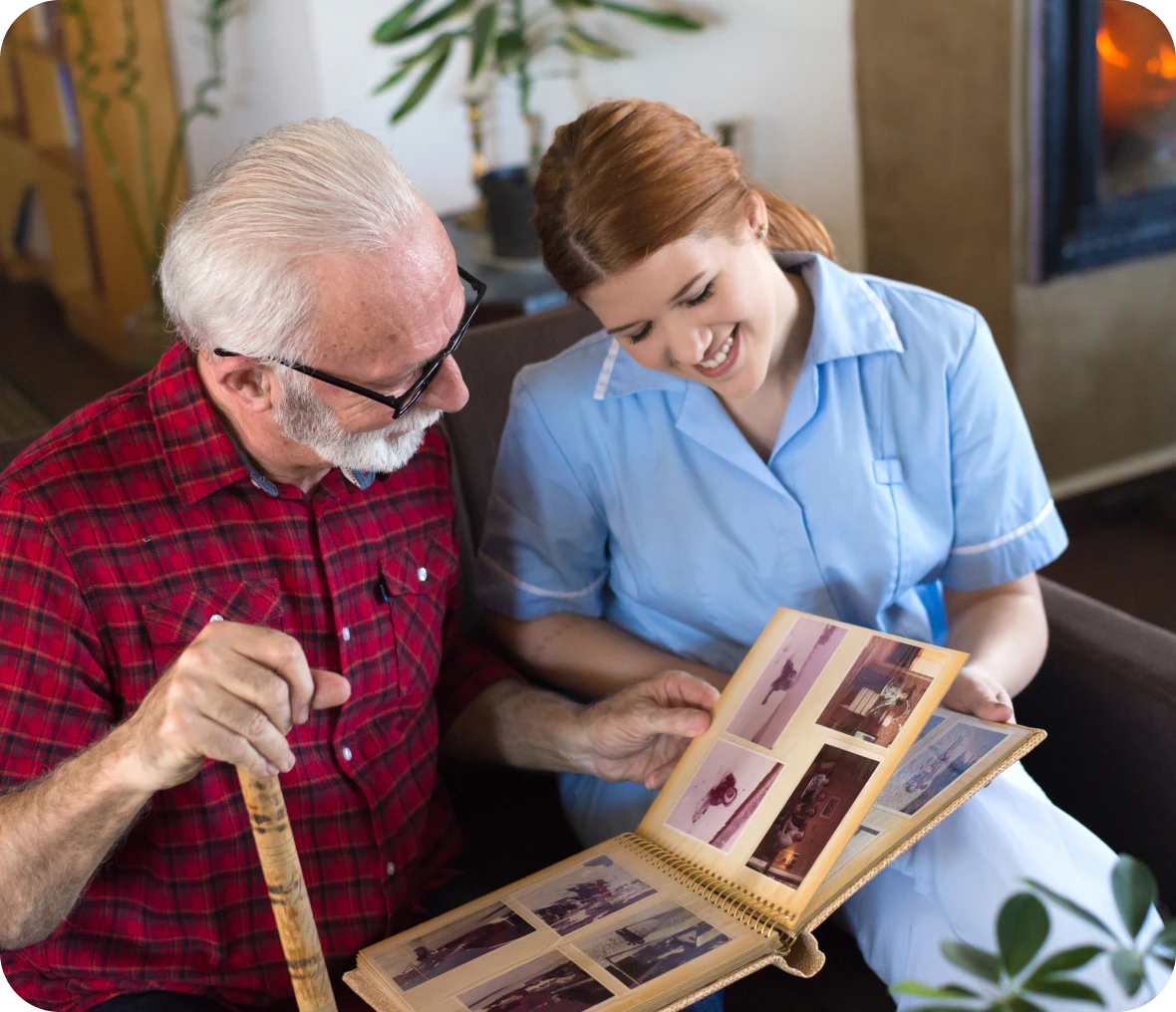 Elderly man and woman looking at photos.