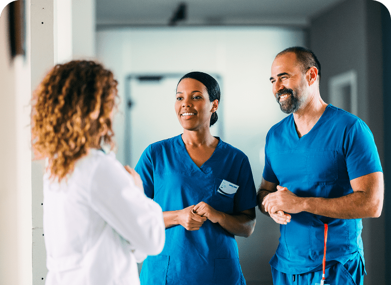Healthcare professionals having a conversation in hospital.